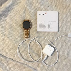 Fossil smart watch with instructions and charger